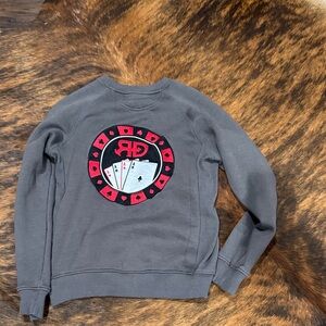 Gray Rocket Donkey sweatshirt with gambler graphics.
